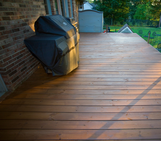 The finished deck with 2 coats of Behr stain sealant, before new railing that will be installed.